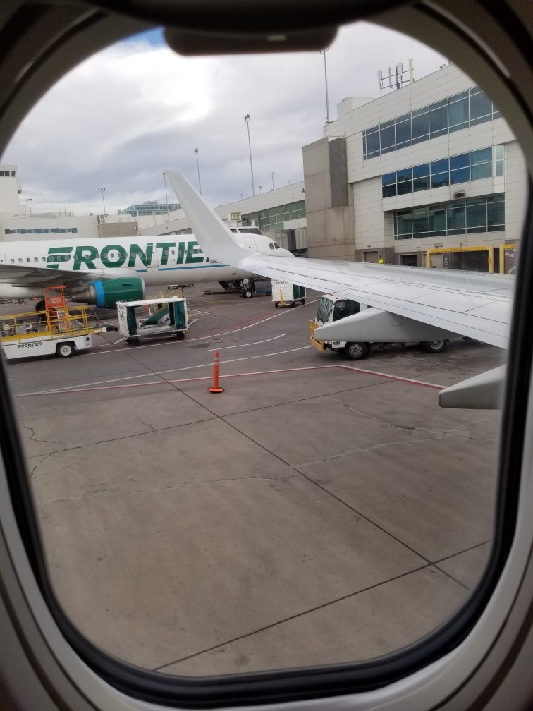 View over airplane wing leaving Denver